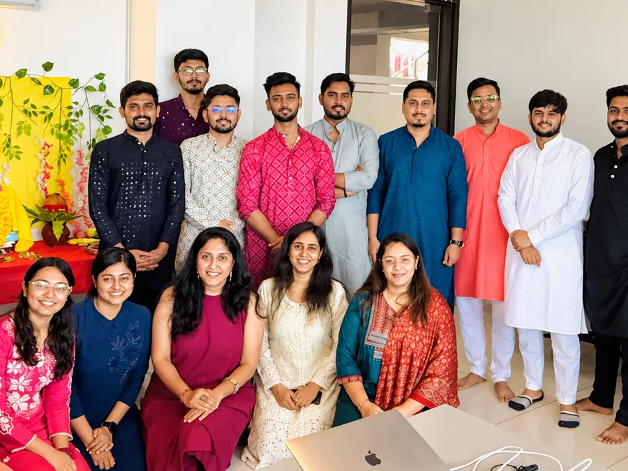 Race Digital team celebrating together at the office